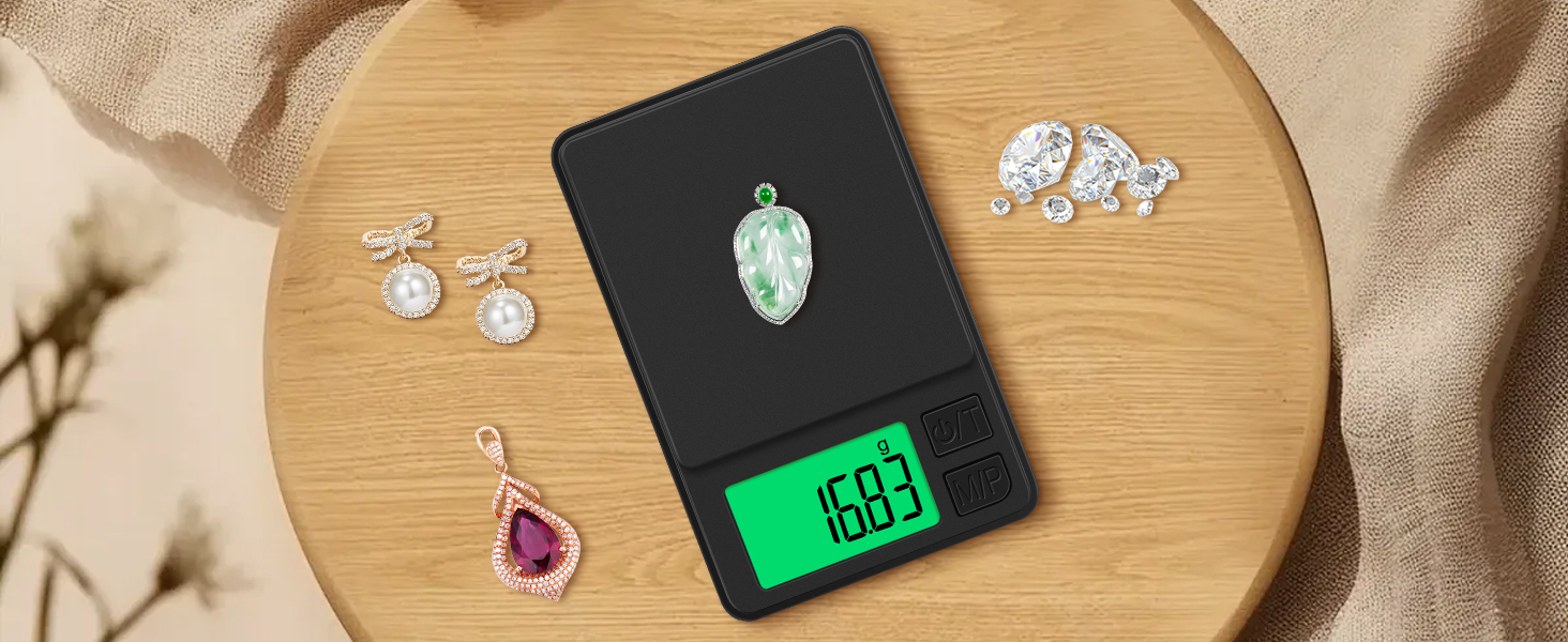 Digital pocket scale with green display showing 0.63 grams, weighing a small light-colored object. Jewelry pieces visible nearby on wooden surface.