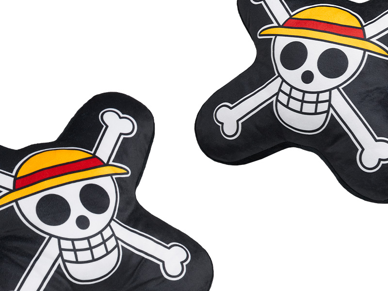 Two black cushions with a pirate-themed skull and crossbones design. The skull wears a yellow-striped hat, set against a dark background.