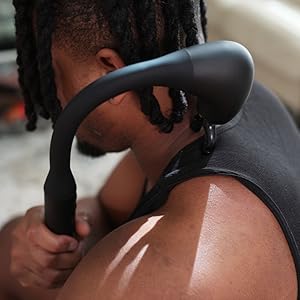 Man using the Backplus Massage Hammer on his back