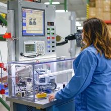 Woman standing in front of testing machine