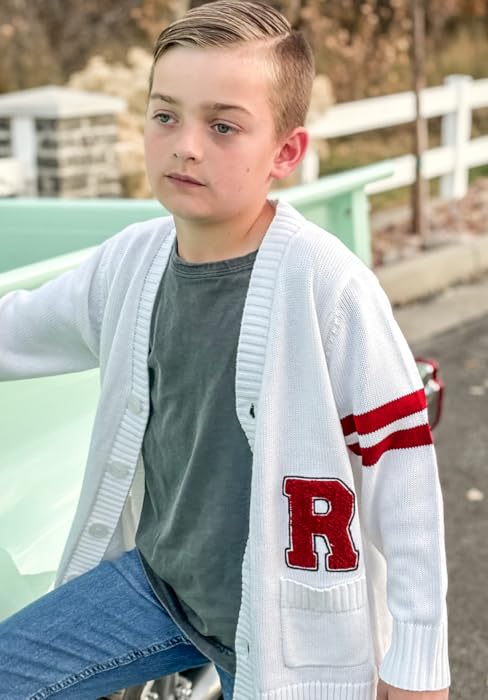 young boy wearing sweater