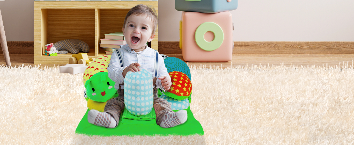 The baby is playing on the tummy time seat