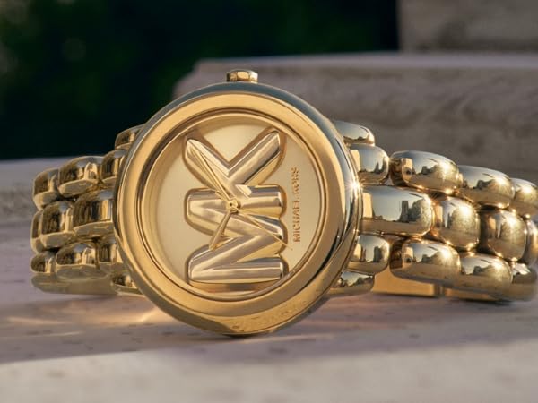 Gold-toned watch with linked bracelet band, shown from multiple angles highlighting its oval face design and metallic finish.