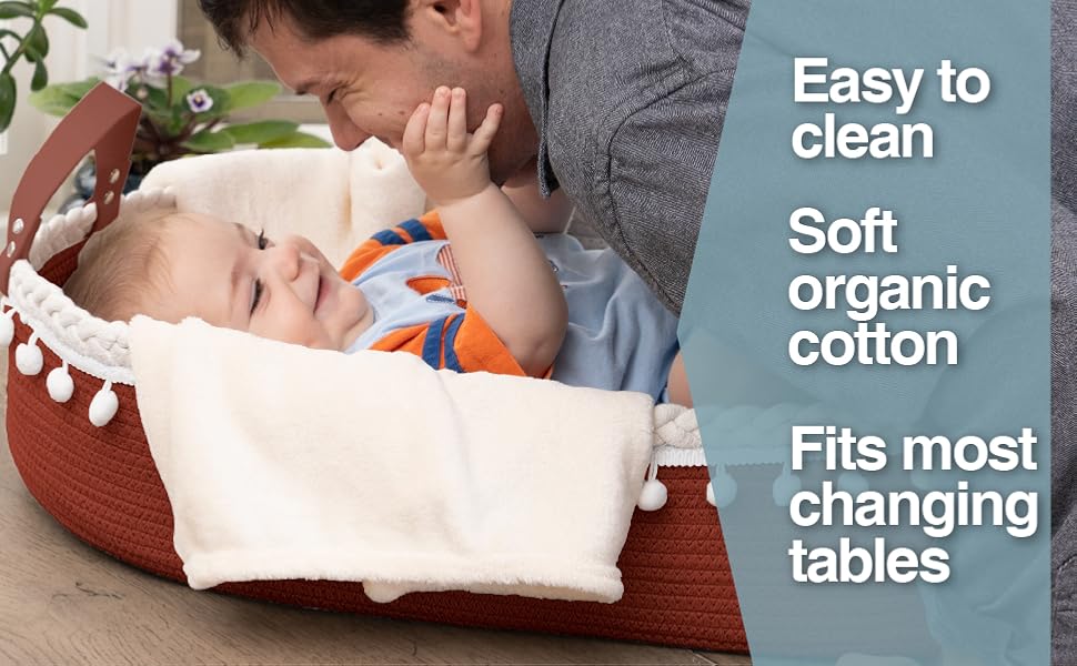 father having quality time with baby in the basket and fleece blanket