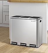 Stainless steel recycling bin with three compartments and foot pedals, positioned against white kitchen cabinets on hardwood flooring.