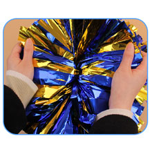 Pull the streamer in another direction to make the pompoms into a ball shape