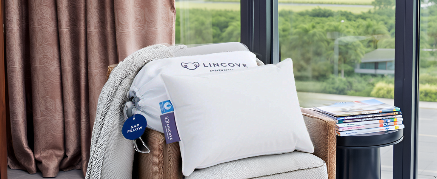 A cozy and inviting scene with the product nestled among soft blankets and pillows on a comfortable 