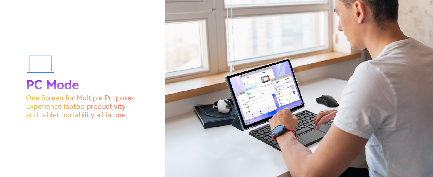 Person using a laptop with multiple windows open, sitting at a desk near a window. Text in corner mentions 'PC Mode'.