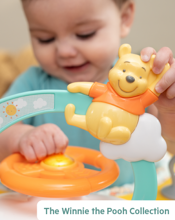 Infant to toddler rocker with vibrations and removable toy bar.