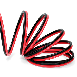 Red and black coiled wire or cable forming a spiral shape against a white background. The cable has a dual-color design with a red outer layer and black inner core.