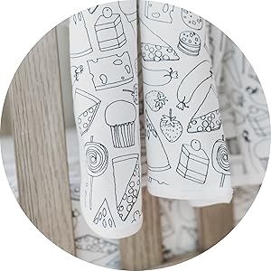 close up image of blanket draped across crib 