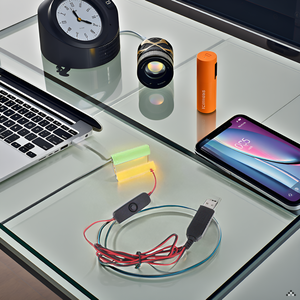 A sleek and modern desk setup with the product neatly arranged alongside a laptop and office supplie