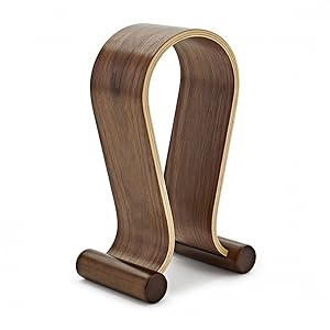 Wooden headphone stand with curved U-shaped design, featuring walnut-colored wood and gold trim accent along the edges.