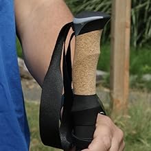 Close-up of cork grip and adjustable wrist strap on trekking poles