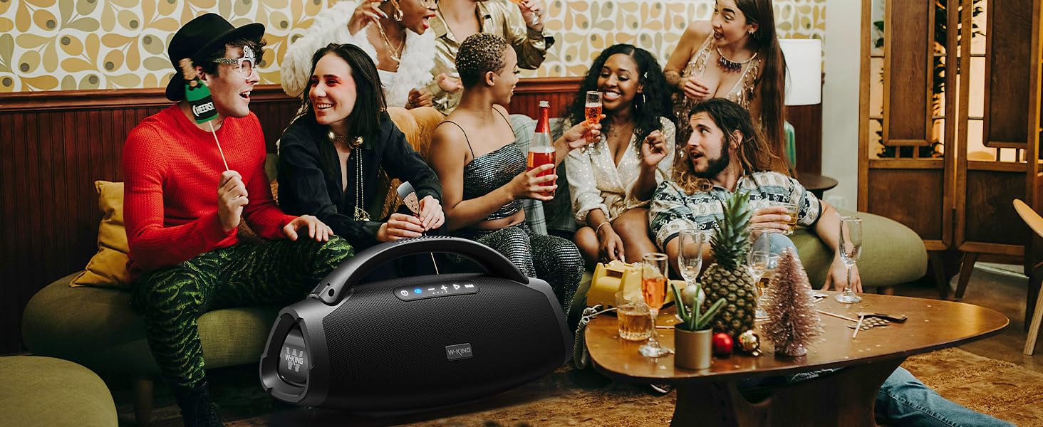 a group of people sitting around a table with drinks.