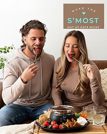 Kusini Smores Maker Tabletop Indoor - Flameless Electric Marshmallow Roaster – 4 Detachable Trays & 4 Roasting Forks – Gift Set & Date Night Idea. Movie Night Supplies & Housewarming Gift 20 a couple enjoying chocolate dipped strawberries with the Kusini Chocolate fondue