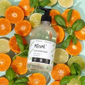 lime basil mandarin hand soap wash on a bed of lime and mandarin slices with basil leaves