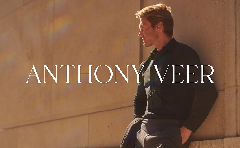 Anthony Veer, Roosevelt, Man wearing dress clothes leaning up against a building