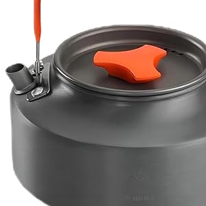 Dark gray camping kettle with orange handle and spout lever, featuring compact design for outdoor use.