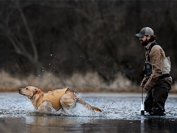 Hunter in water with lab training