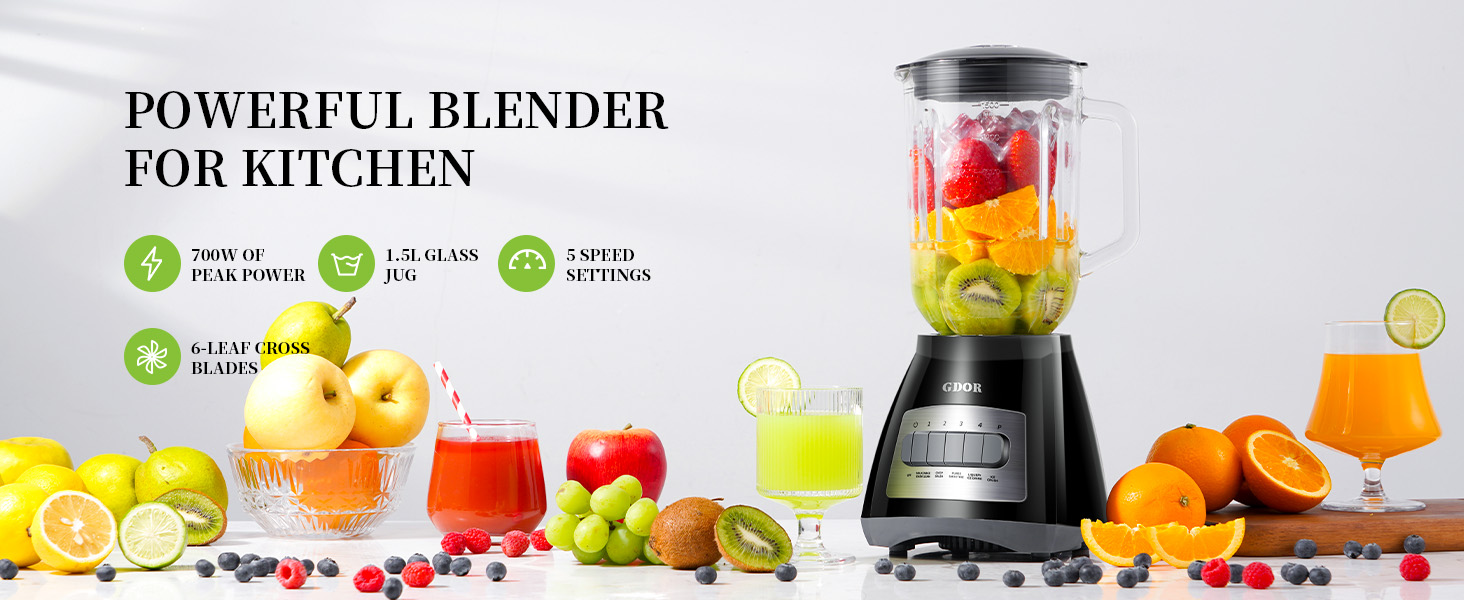 Black countertop blender with glass jar filled with colorful fruits. Surrounded by fresh produce and fruit smoothies, showcasing its use for making nutritious drinks.