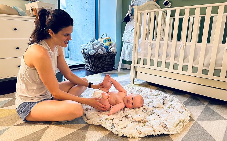 mom and baby in a nursery playing on our premium play mat
