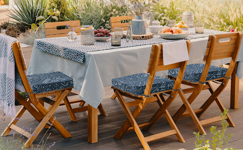 Wooden folding patio dining set with damask blue flower cushions
