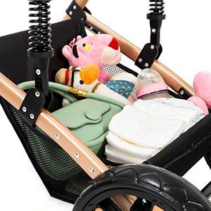 Stroller organizer bag filled with baby essentials. Black mesh container holding toys, diapers, and bottles. Attached to stroller handles with adjustable straps.