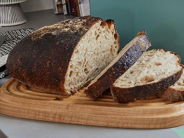 The wood lid doubles as a breadboard; simply flip it over, and let its grooves catch your crumbs.