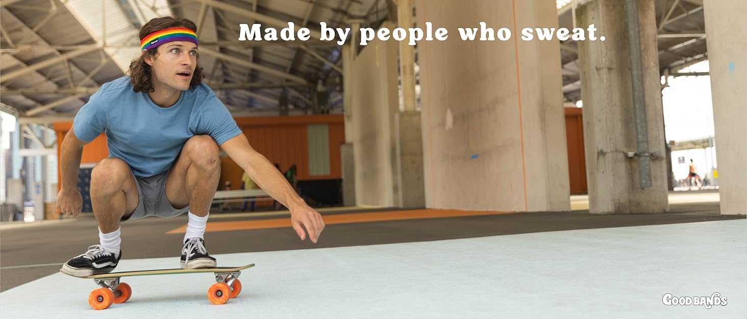 Man riding skateboard with headband