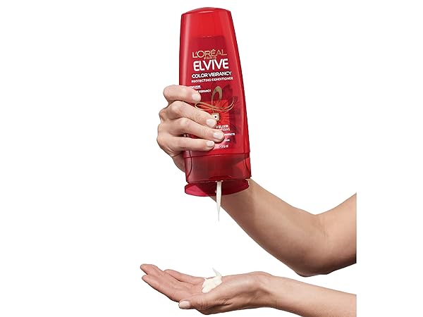 person holding shampoo bottle
