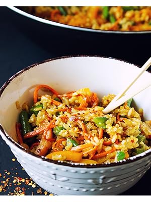 fried brown basmati rice in a bowl with veggies by food to live