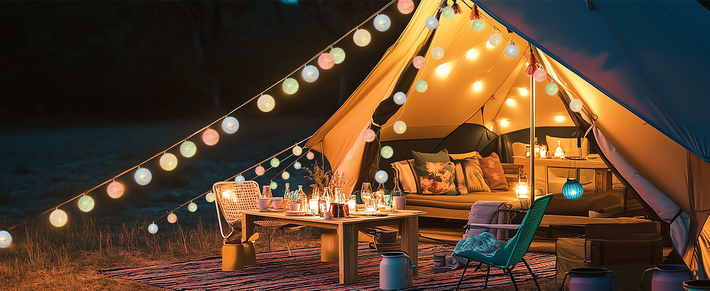 a tent with lights and a table in the middle