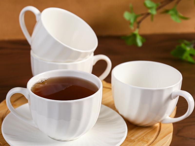 A coffee cup placed on a wooden serving tray.