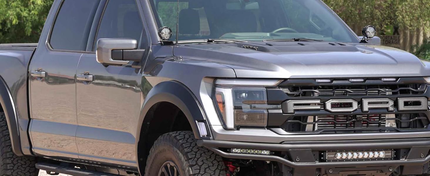 A truck equipped with a pair of ditch light brackets for improved off-road visibility.