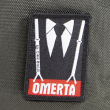 the Omerta logo on the Capo Locking Carbon Filter Pouch is completely removable and interchangeable