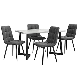 Modern dining set with white marble-effect table and four gray quilted chairs featuring black metal legs.