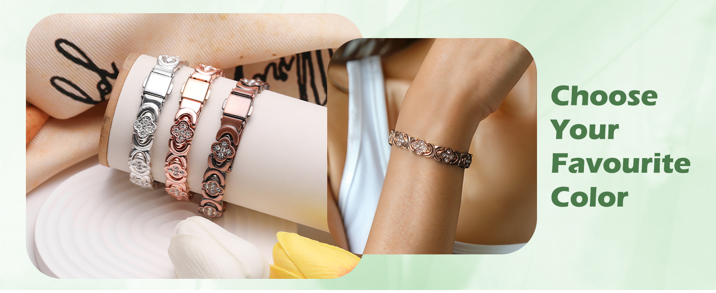Set of three decorative metal bracelets with intricate floral designs, shown in silver, rose gold, and gold tones. A separate thin chain bracelet is visible on a wrist.