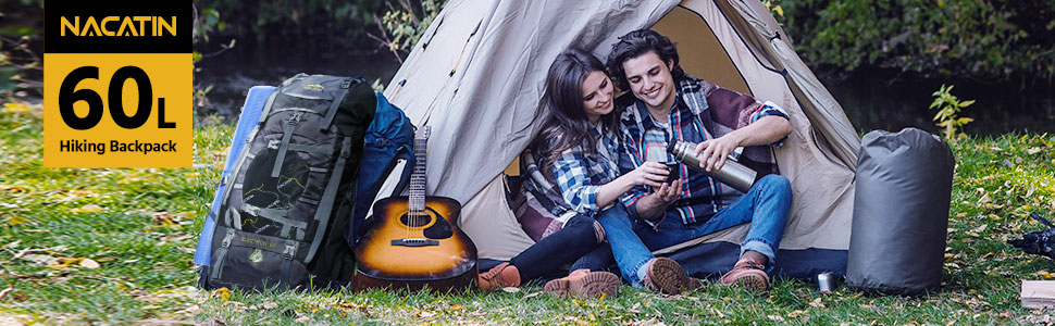 a couple sitting in a tent with a guitar