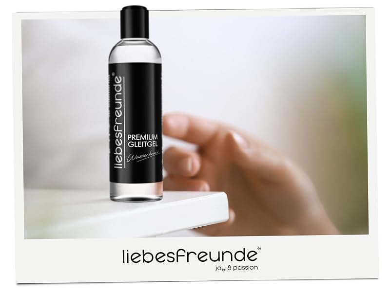 Clear glass bottle with black label and cap on white surface. Brand name 'liebesfreunde' visible at bottom of image.
