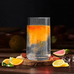 Glass of juice with fruits on the table
