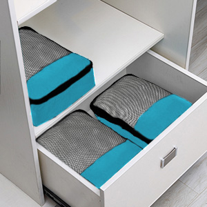 set of packing cubes in a drawer