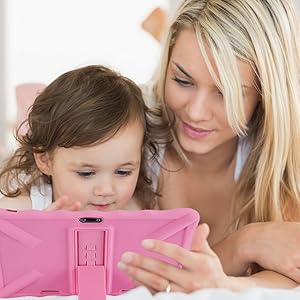 a mother and daughter looking at a tablet