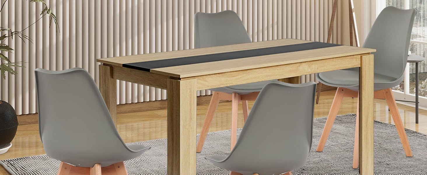 Der Esstisch hat ein modernes Design mit modernem Design.