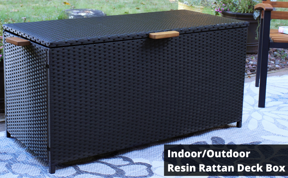 Indoor/Outdoor Resin Rattan Deck Box shown outdoors on patio.