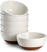 Set of white ceramic bowls with terracotta-colored bases stacked together. Clean, minimalist design with smooth finish.