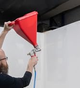 Texture Pro 200 Hopper Gun sprayer joint compound on a new drywall wall