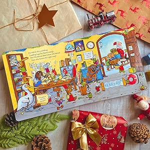 Lifestyle image of inside spread of the book with christmas props decorating