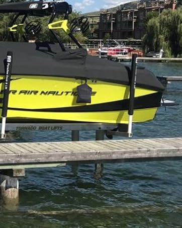 yellow boat with cover and black mooring bag