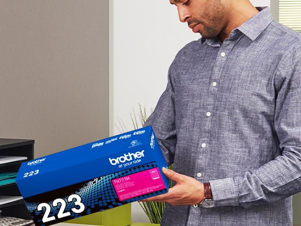 Man Carrying TN223M Box